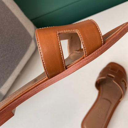 HERM Oran Slide Sandals In Gold Swift Calfskin