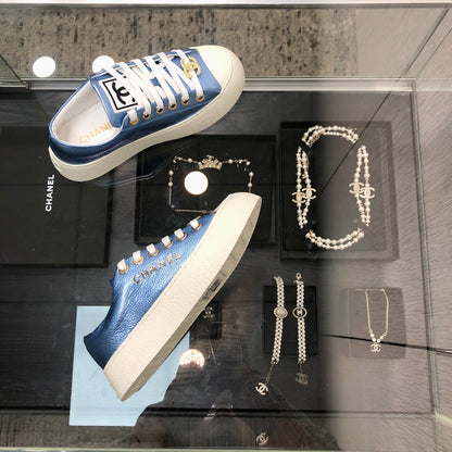 CASUAL SNEAKER IN CERULEAN BLUE METALLIC LAMBSKIN WITH GOLD LOGO