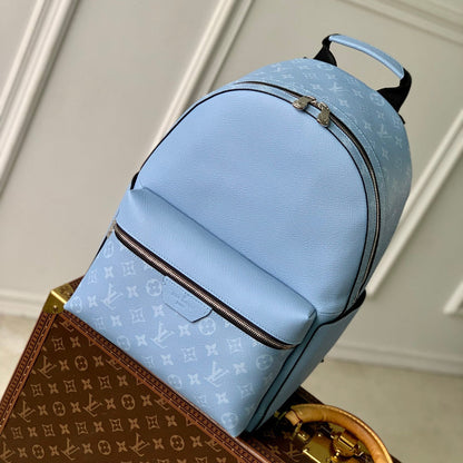 DISCOVERY SLIM BACKPACK 38 BLUE MONOGRAM COATED CANVAS AND CALFSKIN