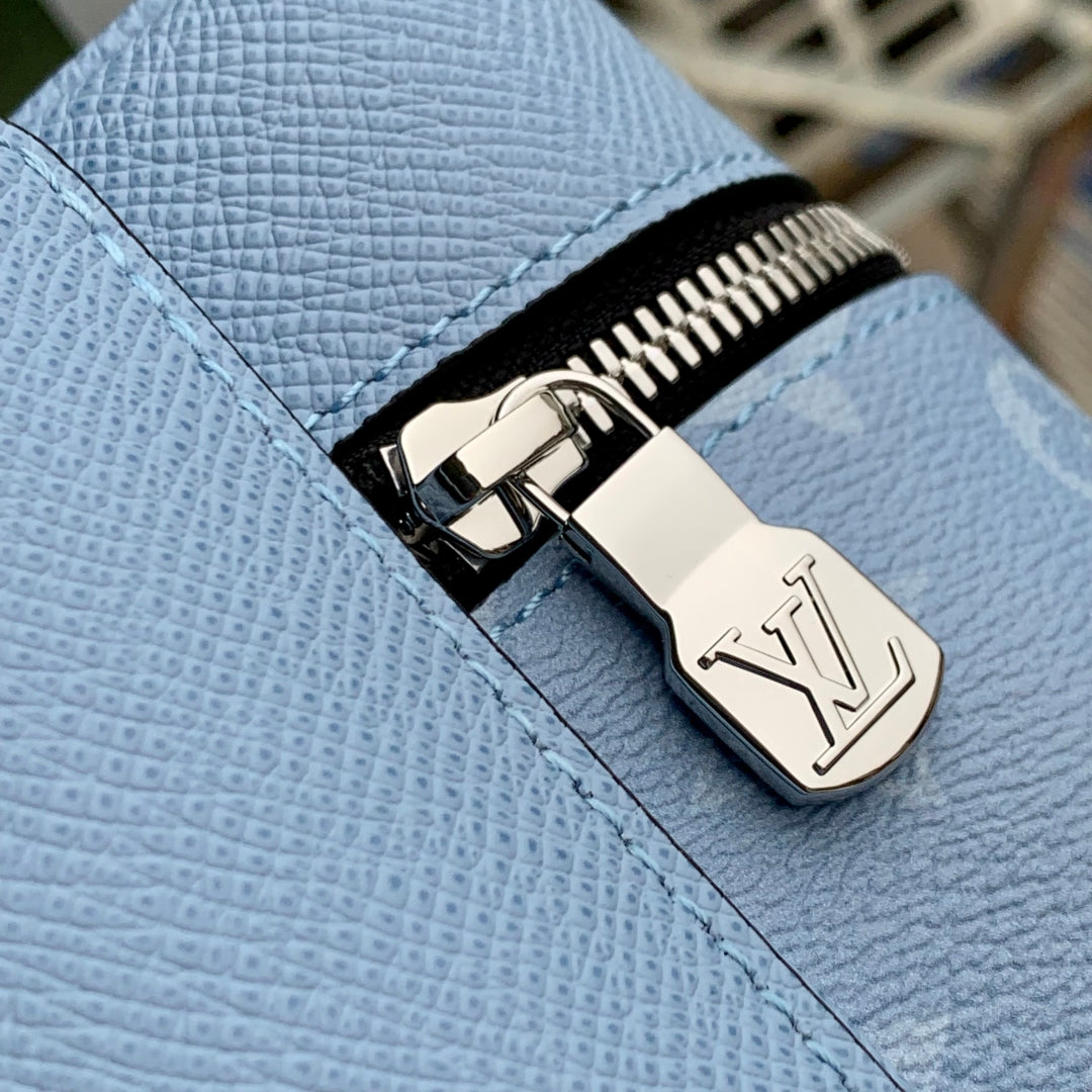 DISCOVERY SLIM BACKPACK 38 BLUE MONOGRAM COATED CANVAS AND CALFSKIN