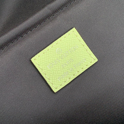 DISCOVERY SLIM BACKPACK 38 IN LEMON YELLOW MONOGRAM ECLIPSE REVERSE CALFSKIN