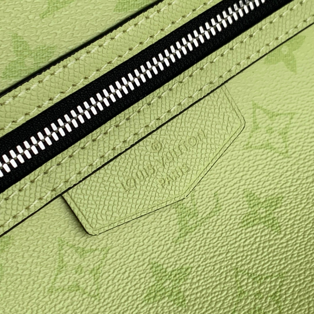 DISCOVERY SLIM BACKPACK 38 IN LEMON YELLOW MONOGRAM ECLIPSE REVERSE CALFSKIN