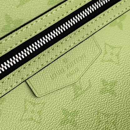 DISCOVERY SLIM BACKPACK 38 IN LEMON YELLOW MONOGRAM ECLIPSE REVERSE CALFSKIN