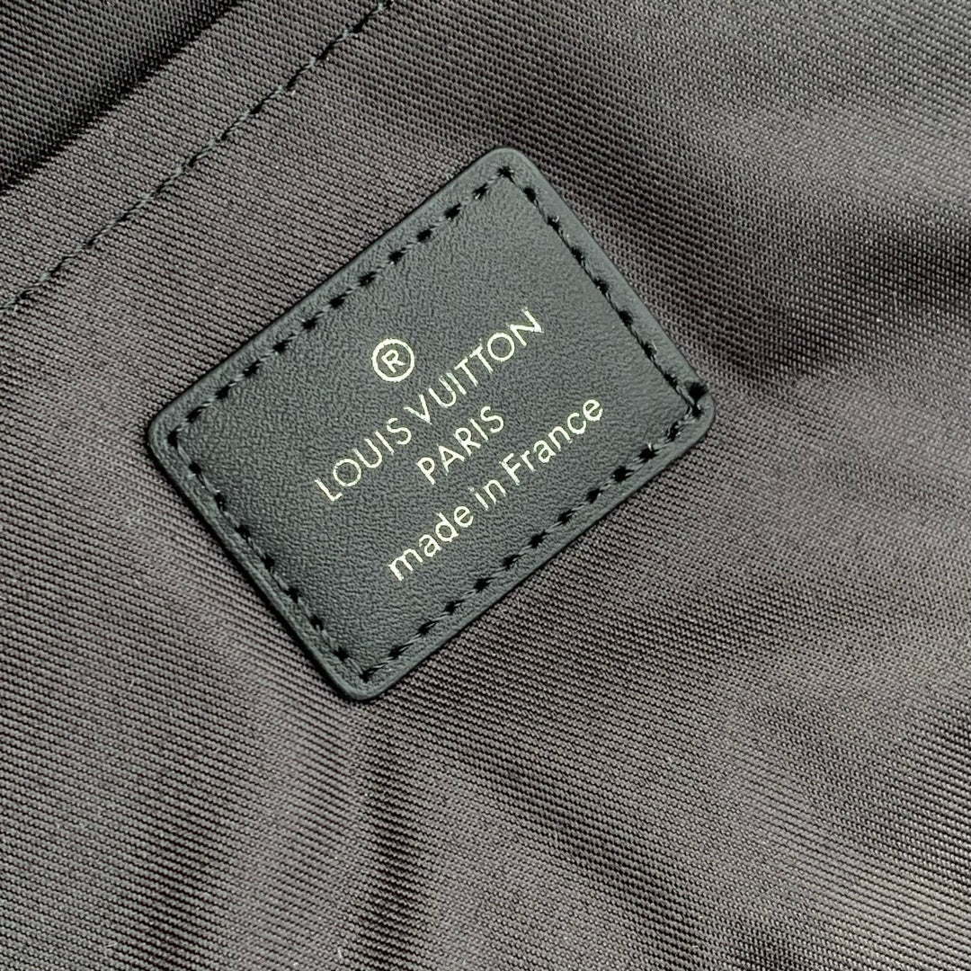 DISCOVERY SLIM BACKPACK 38 IN BLACK MONOGRAM ECLIPSE COATED CALFSKIN