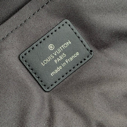 DISCOVERY SLIM BACKPACK 38 IN BLACK MONOGRAM ECLIPSE COATED CALFSKIN