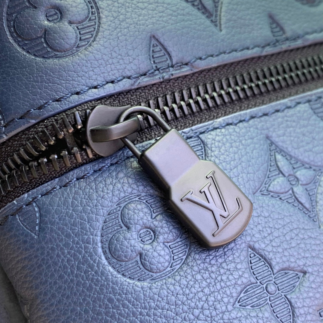 DISCOVERY PM BACKPACK 38 IN NAVY BLUE LAMBSKIN EMBOSSED MONOGRAM LOGO