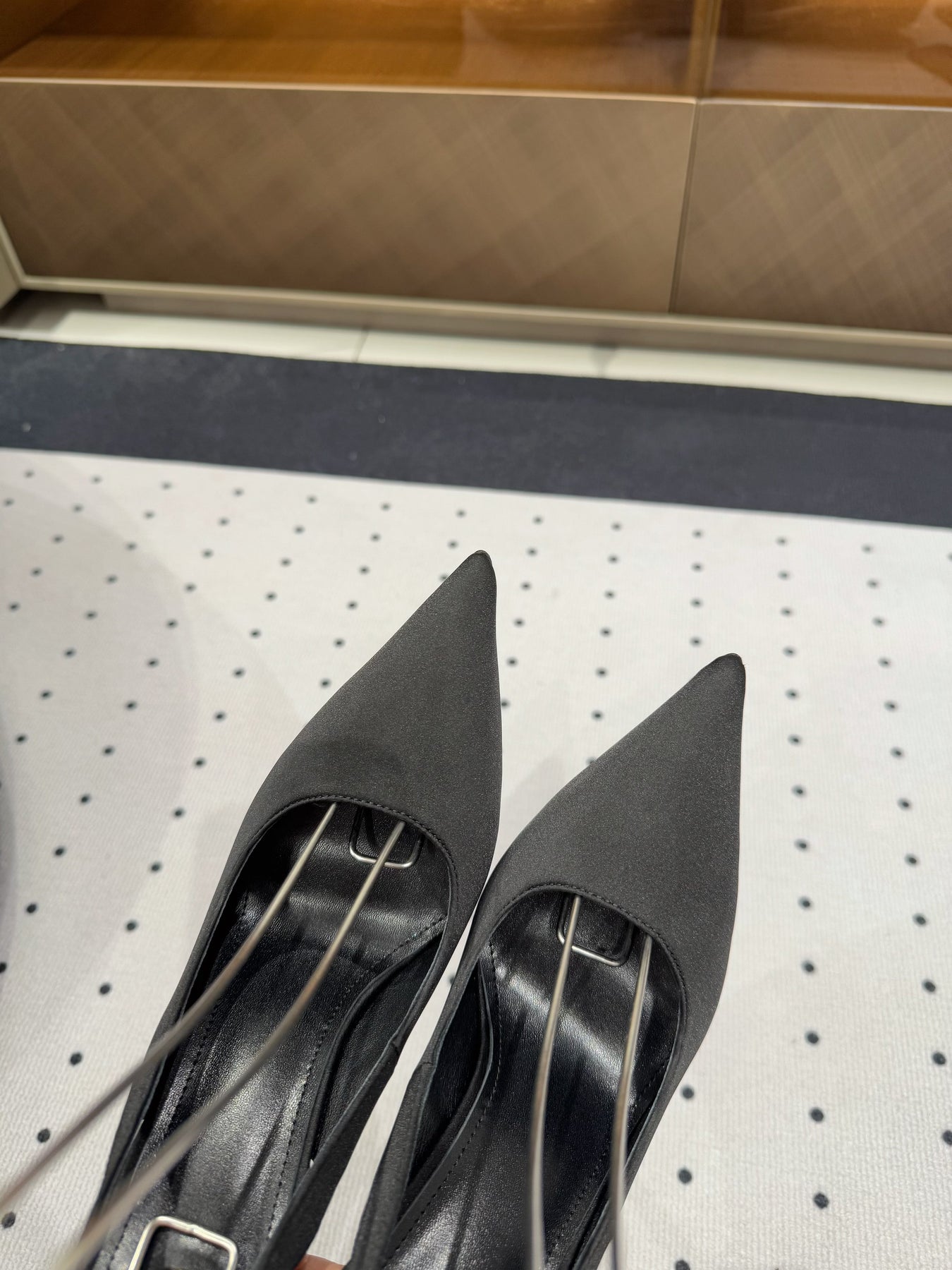 L'ENTRACTE SLINGBACK PUMPS IN BLACK SATIN