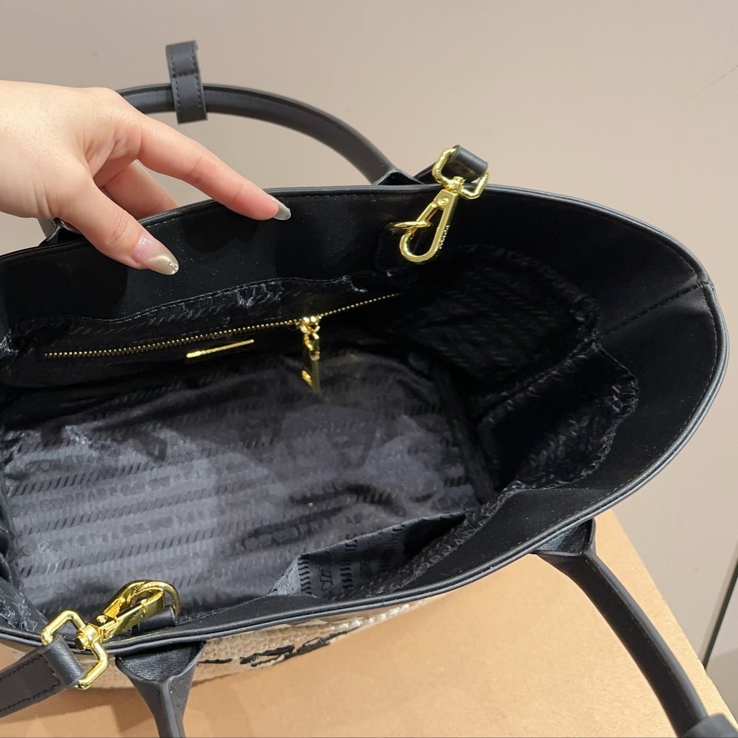 CROCHET TOTE BAG 28 IN BEIGE WOVEN RAFFIA WITH BLACK CALFSKIN STRAP