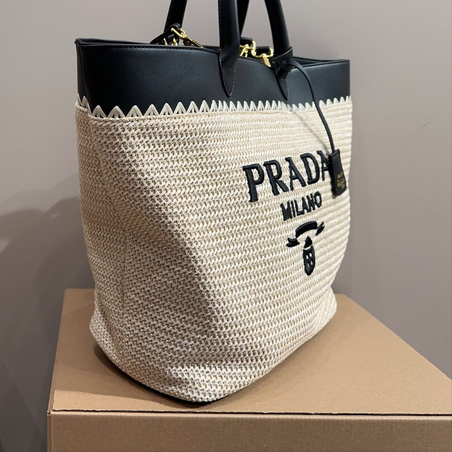 CROCHET TOTE BAG 32 IN BEIGE WOVEN RAFFIA WITH BLACK CALFSKIN STRAP