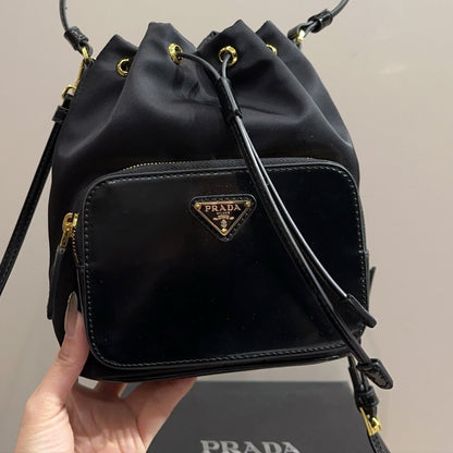 BUCKET BAG 22 IN BLACK RE-NYLON AND CALFSKIN HANDLE