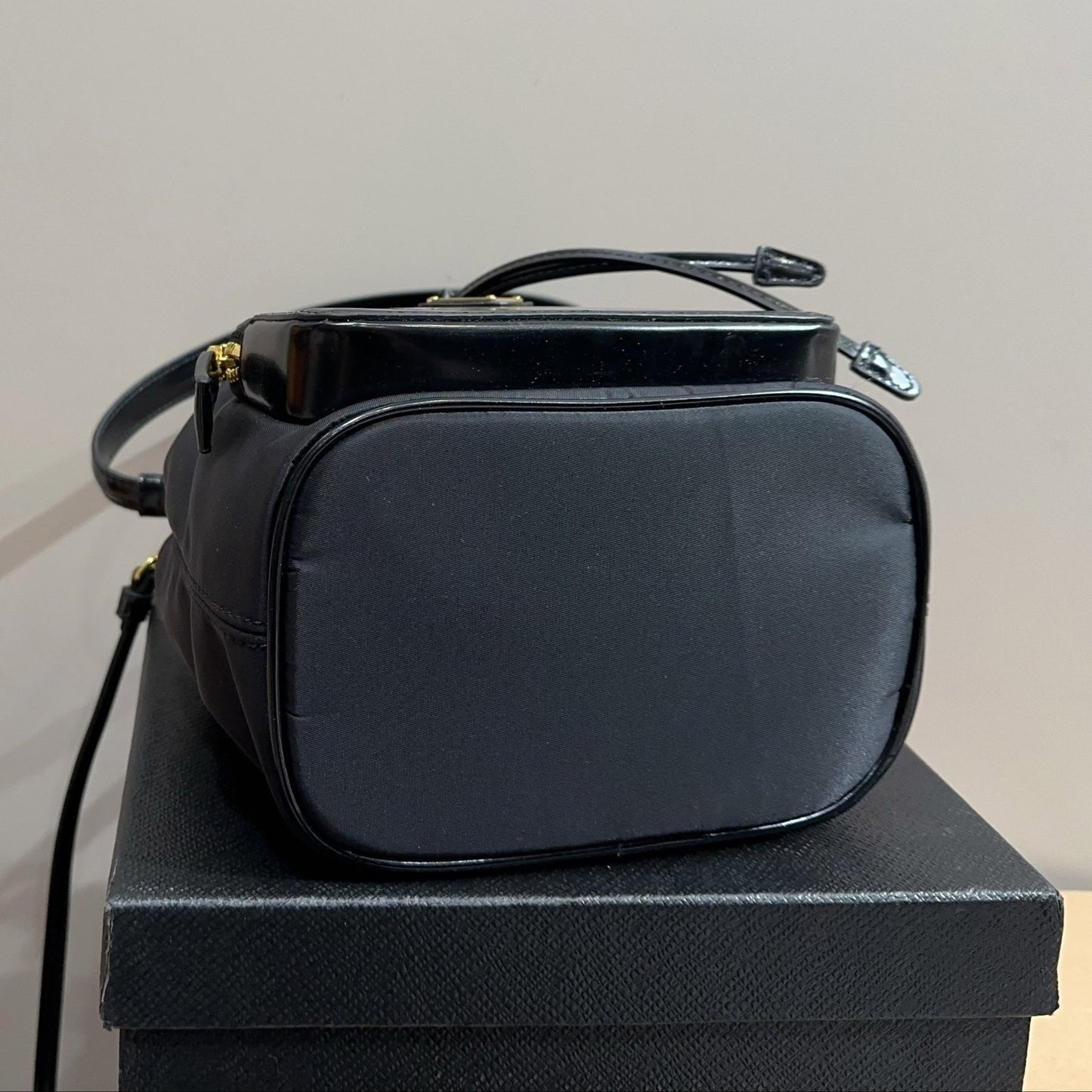 BUCKET BAG 22 IN BLACK RE-NYLON AND CALFSKIN HANDLE