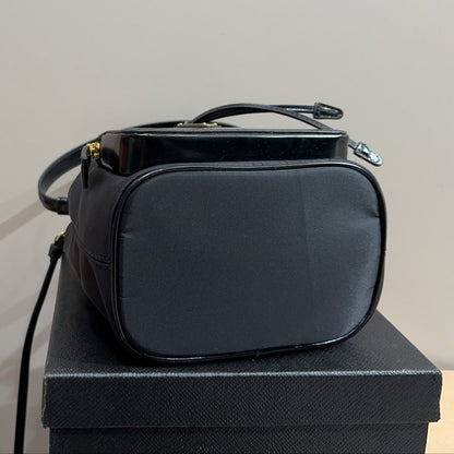 BUCKET BAG 22 IN BLACK RE-NYLON AND CALFSKIN HANDLE