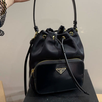 BUCKET BAG 22 IN BLACK RE-NYLON AND CALFSKIN HANDLE