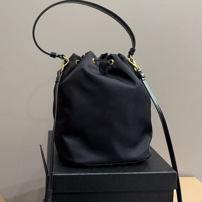 BUCKET BAG 22 IN BLACK RE-NYLON AND CALFSKIN HANDLE