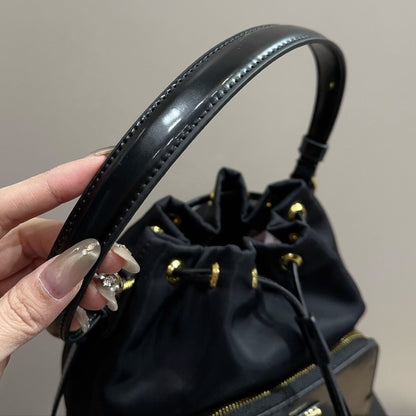 BUCKET BAG 22 IN BLACK RE-NYLON AND CALFSKIN HANDLE