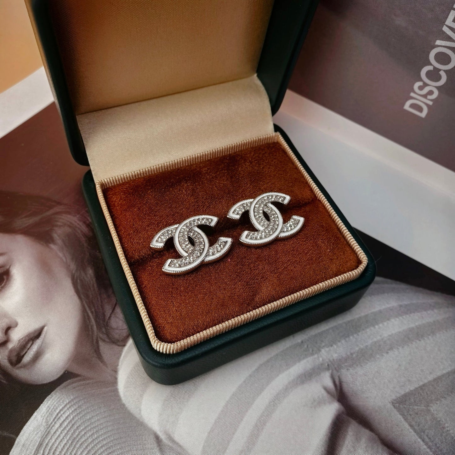 DOUBLE C STUD EARRINGS WITH WHITE TRIM AND CLEAR STONE LOGO