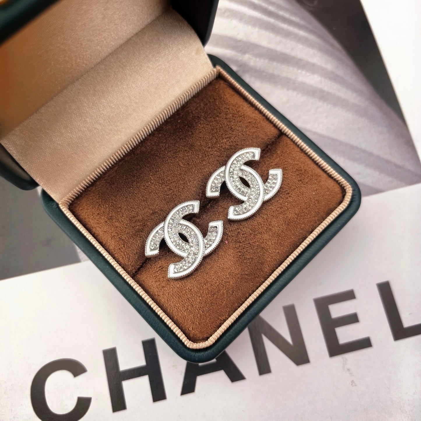 DOUBLE C STUD EARRINGS WITH WHITE TRIM AND CLEAR STONE LOGO