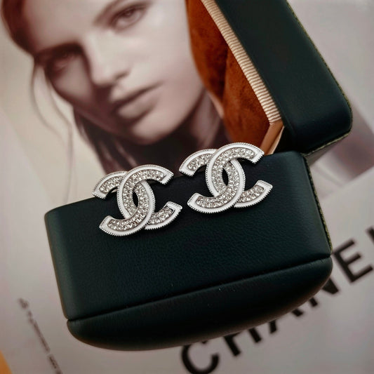 DOUBLE C STUD EARRINGS WITH WHITE TRIM AND CLEAR STONE LOGO