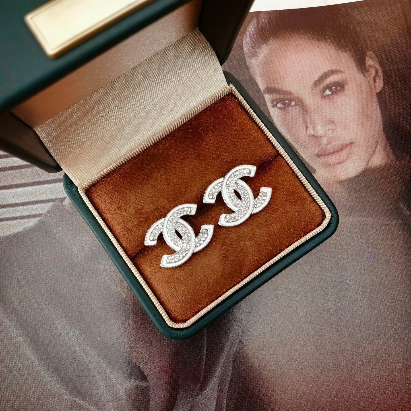 DOUBLE C STUD EARRINGS WITH WHITE TRIM AND CLEAR STONE LOGO