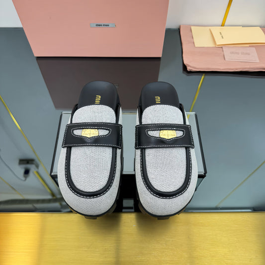 MULES SLIPPERS IN BLACK CALFSKIN AND WHITE DOTS CANVAS WITH GOLD COIN