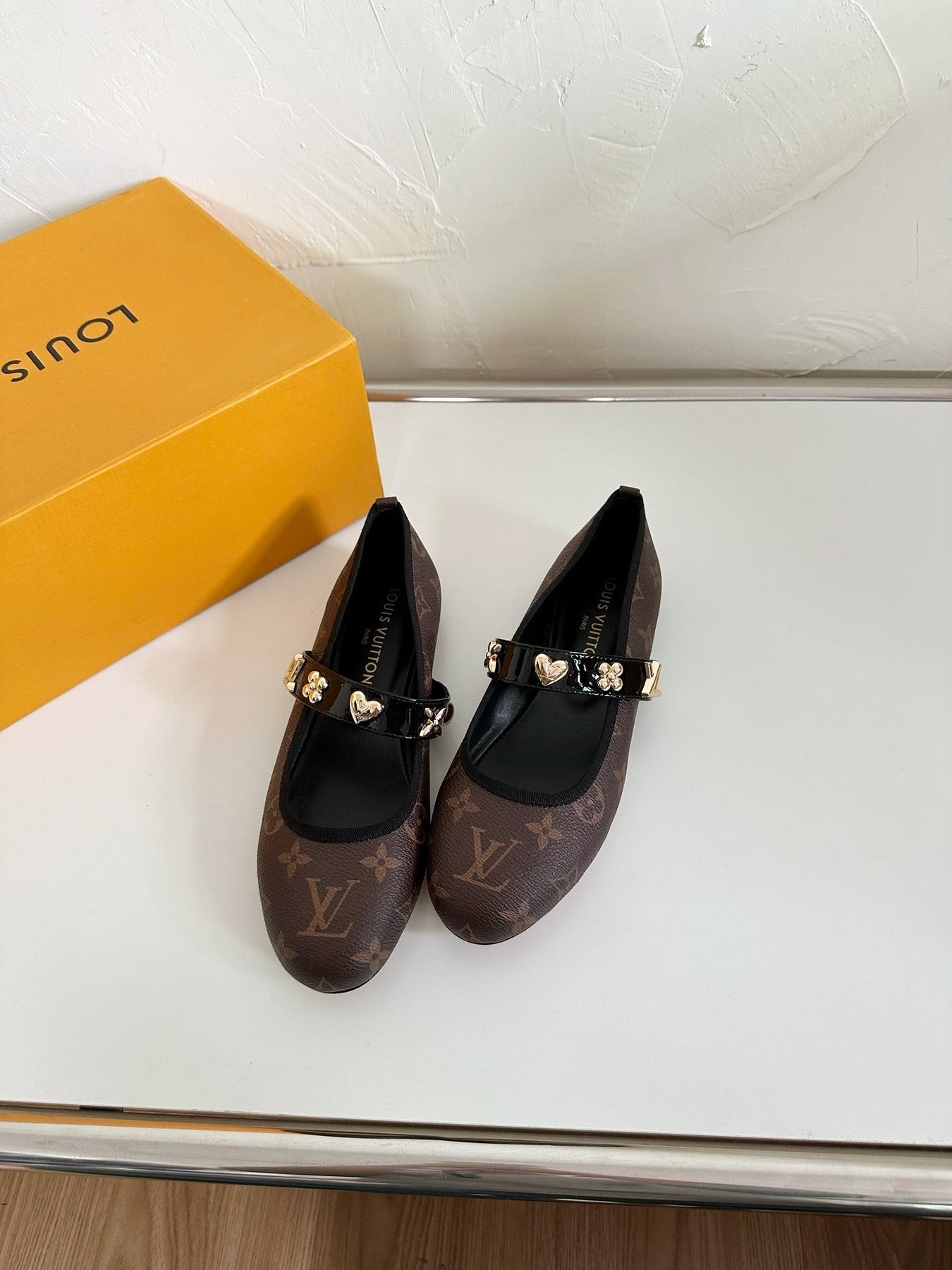 ROMY FLAT BALLERINA IN CHOCOLATE BROWN MONOGRAM CALFSKIN