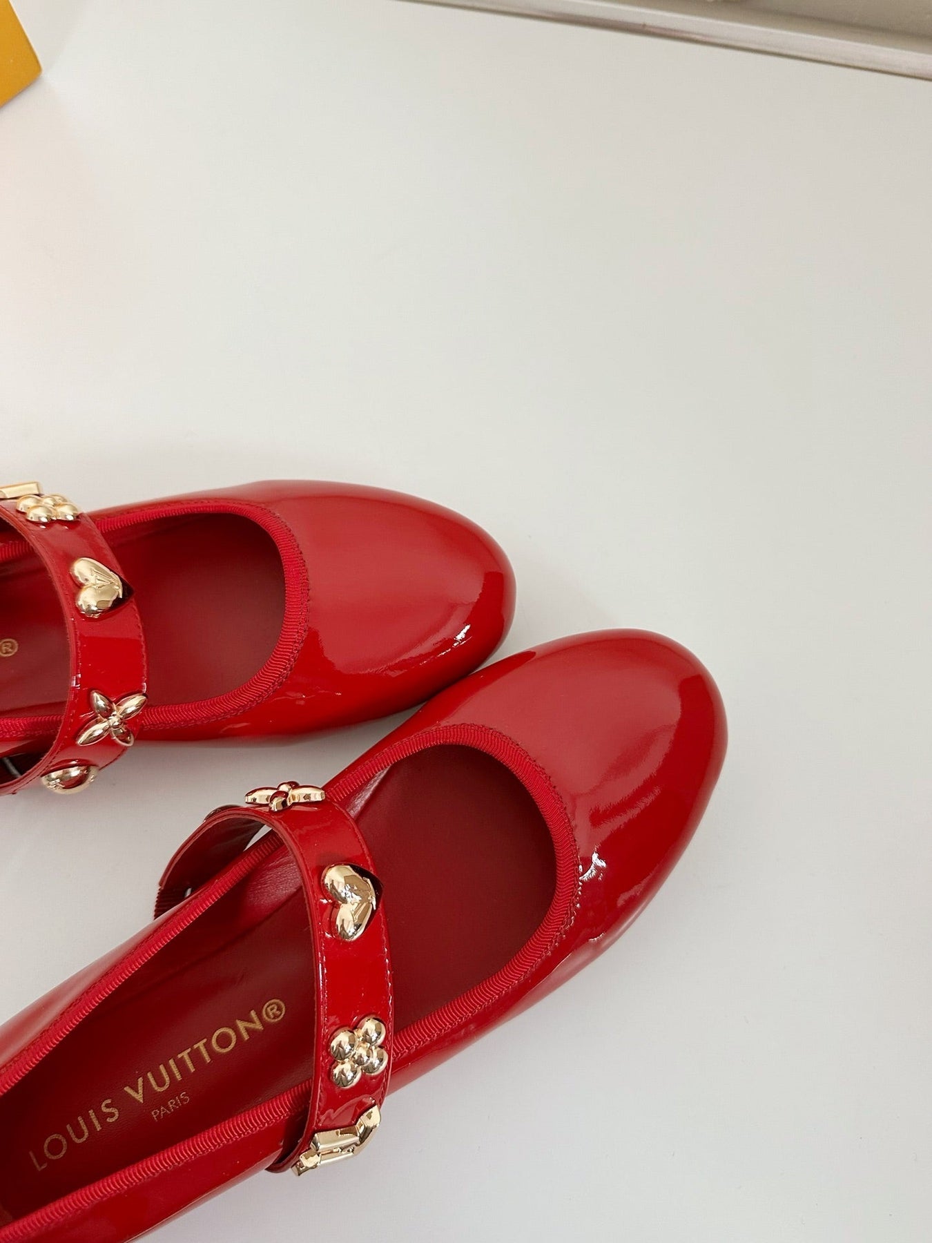 ROMY FLAT BALLERINA IN RUBY RED PATENT CALFSKIN