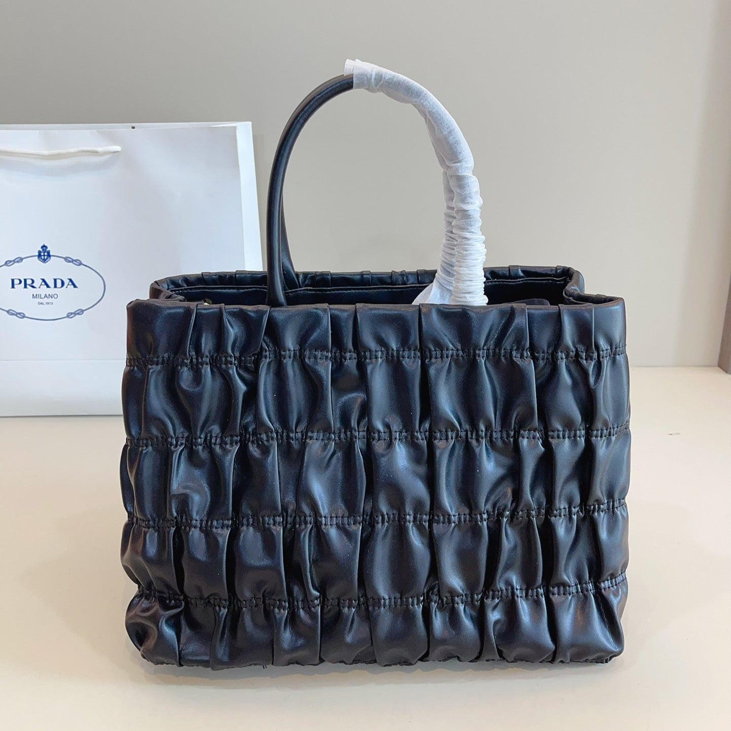 BOW DETAIL RUCHED TOP HANDLE BAG 29 IN BLACK SAFFIANO LEATHER