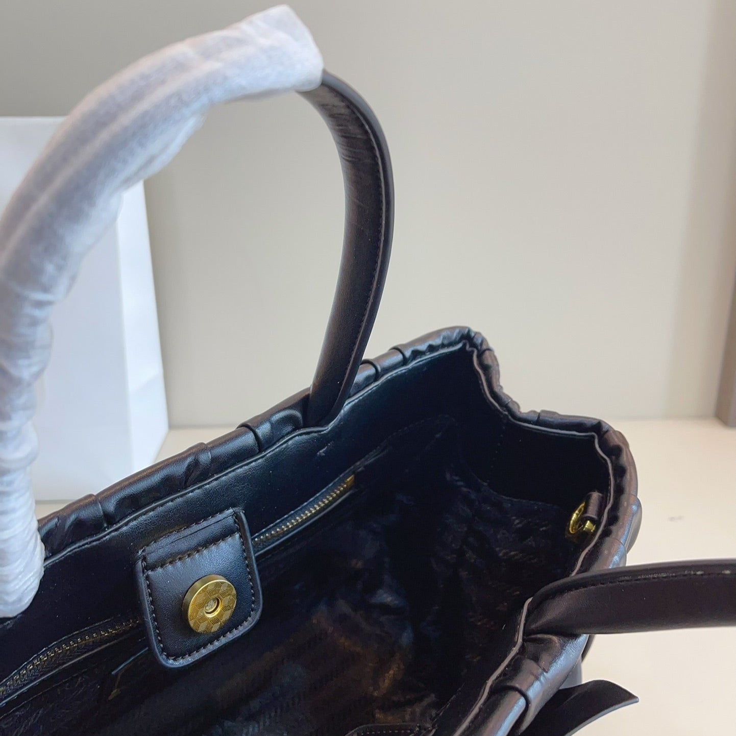 BOW DETAIL RUCHED TOP HANDLE BAG 29 IN BLACK SAFFIANO LEATHER