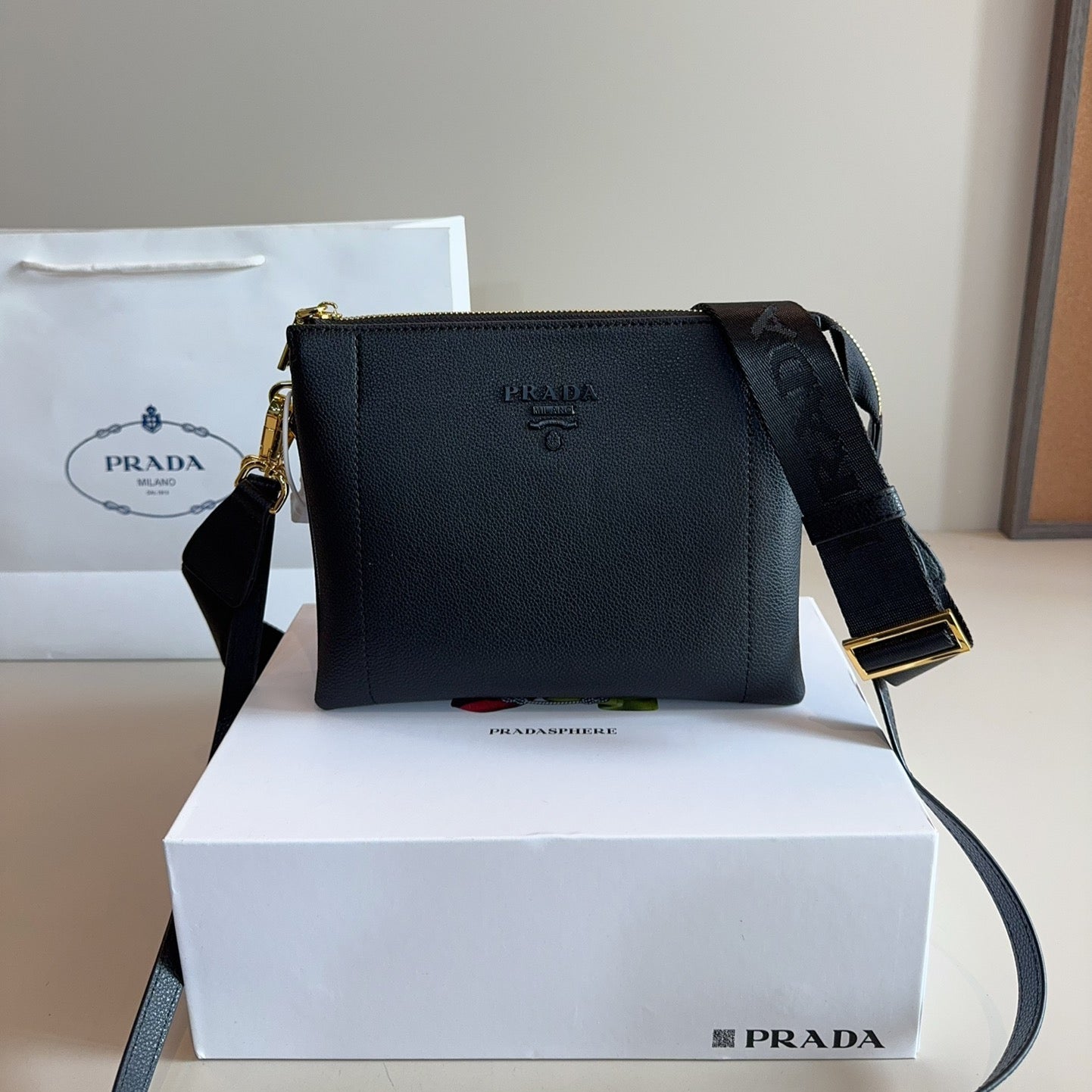 EMBOSSED LOGO HOBO SHOULDER BAG 23 IN BLACK SHINY SAFFIANO LEATHER