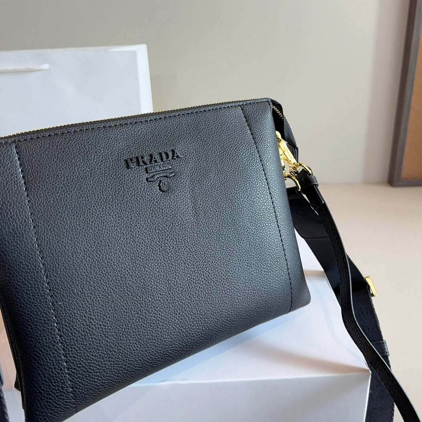 EMBOSSED LOGO HOBO SHOULDER BAG 23 IN BLACK SHINY SAFFIANO LEATHER