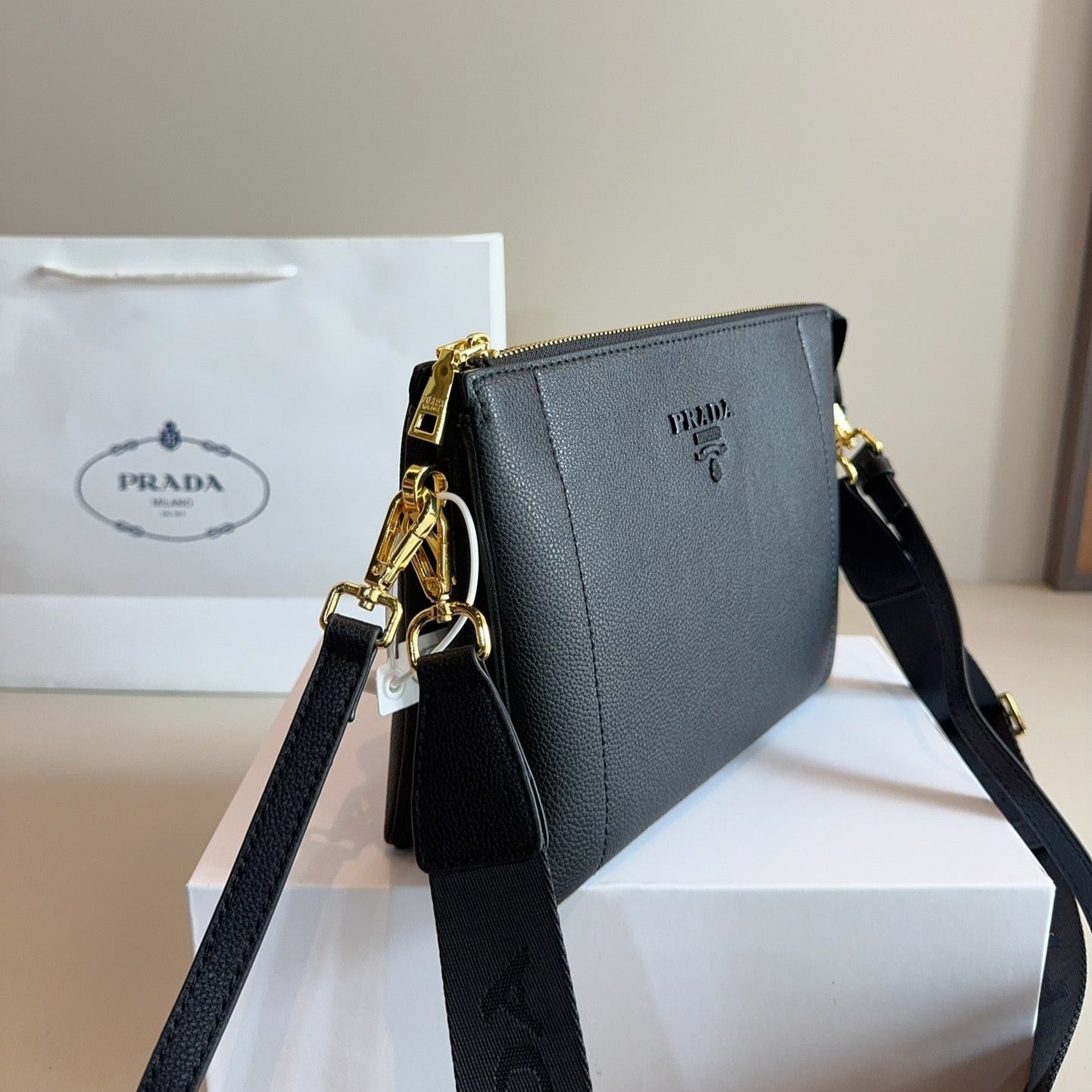 EMBOSSED LOGO HOBO SHOULDER BAG 23 IN BLACK SHINY SAFFIANO LEATHER