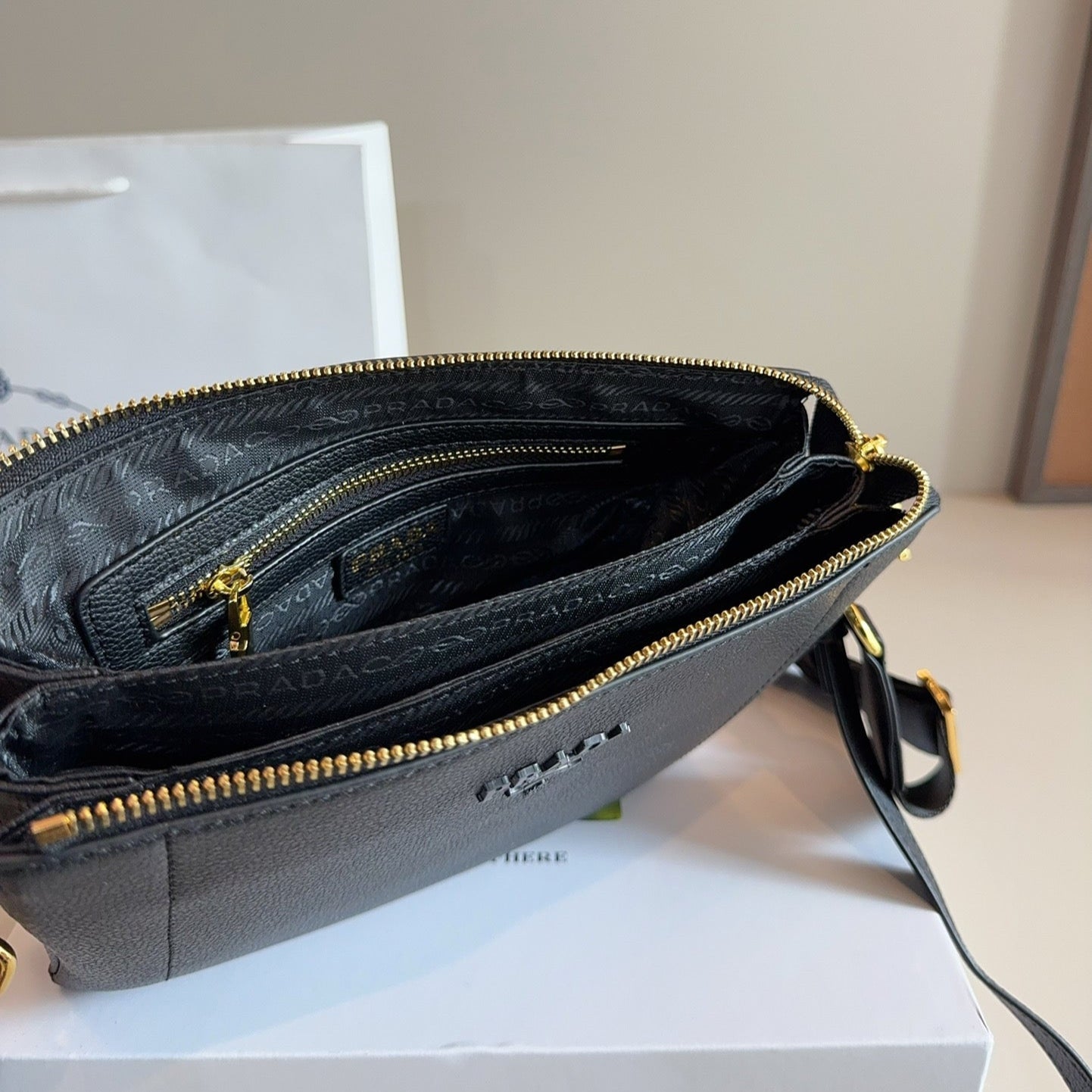 EMBOSSED LOGO HOBO SHOULDER BAG 23 IN BLACK SHINY SAFFIANO LEATHER