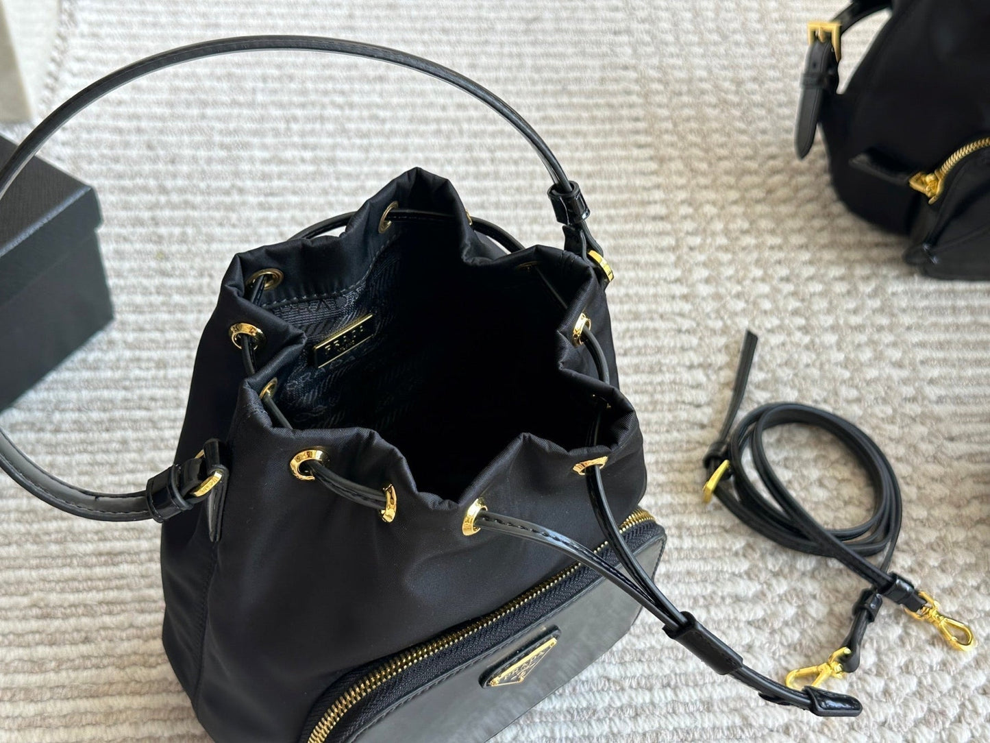 DRAWSTRING HOBO BAG 21 IN BLACK RE-NYLON AND CALFSKIN HANDLE