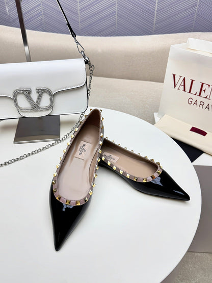 ROCKSTUD FLAT PUMP IN BLACK CALFSKIN