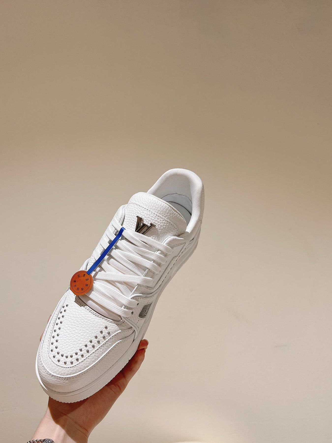 LV TRAINER SNEAKER IN WHITE CALFSKIN