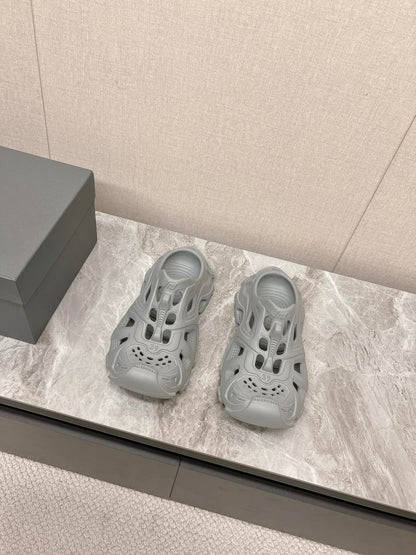 CUT-OUT MULES IN GRAY RUBBER