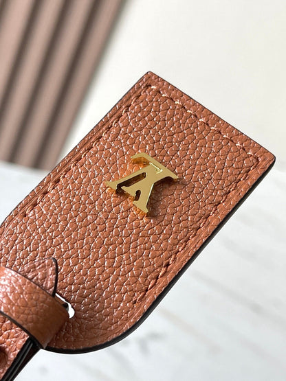 CARRYALL PM 29 IN COGNAC MONOGRAM EMPREINTE LEATHER GOLD LOGO