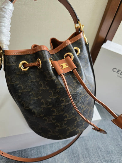 CLARA BAG 19 IN BLACK TRIOMPHE CANVAS AND BROWN CALFSKIN TRIM