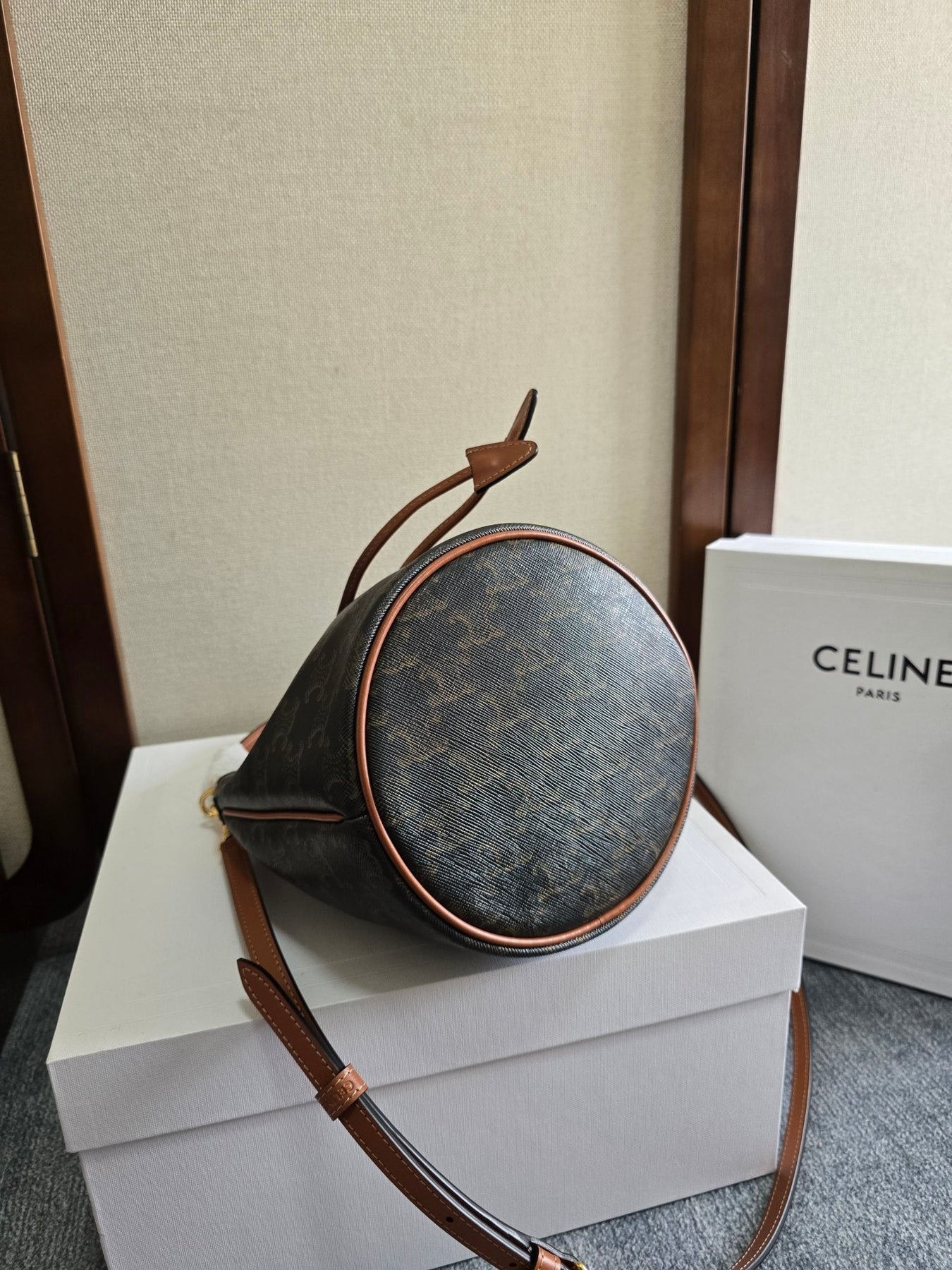 CLARA BAG 19 IN BLACK TRIOMPHE CANVAS AND BROWN CALFSKIN TRIM