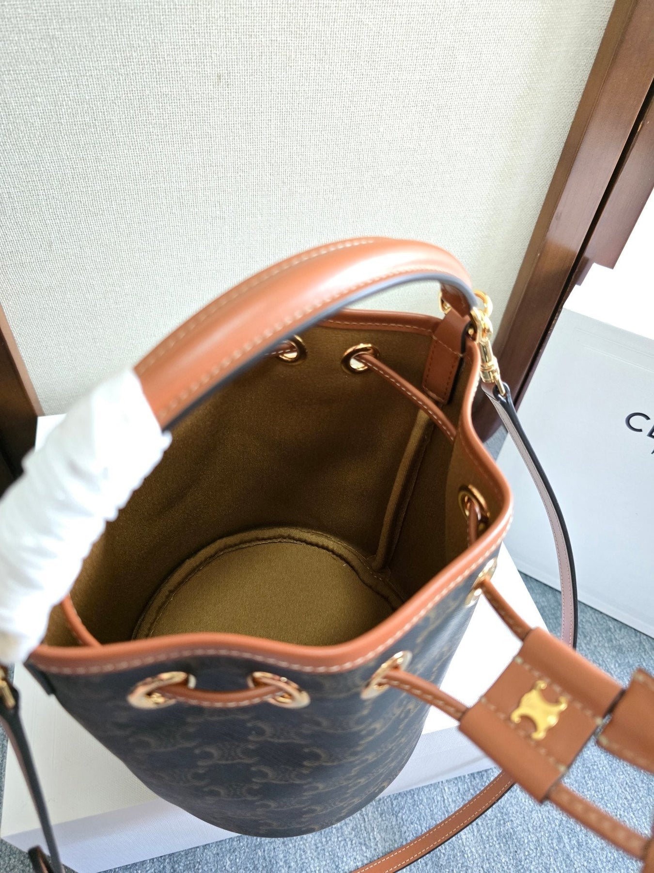 CLARA BAG 19 IN BLACK TRIOMPHE CANVAS AND BROWN CALFSKIN TRIM