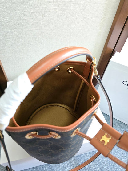CLARA BAG 19 IN BLACK TRIOMPHE CANVAS AND BROWN CALFSKIN TRIM