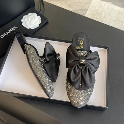 BIG BOW FLAT MULE SANDALS IN BLACK SILK WITH GLITTER SEQUINS