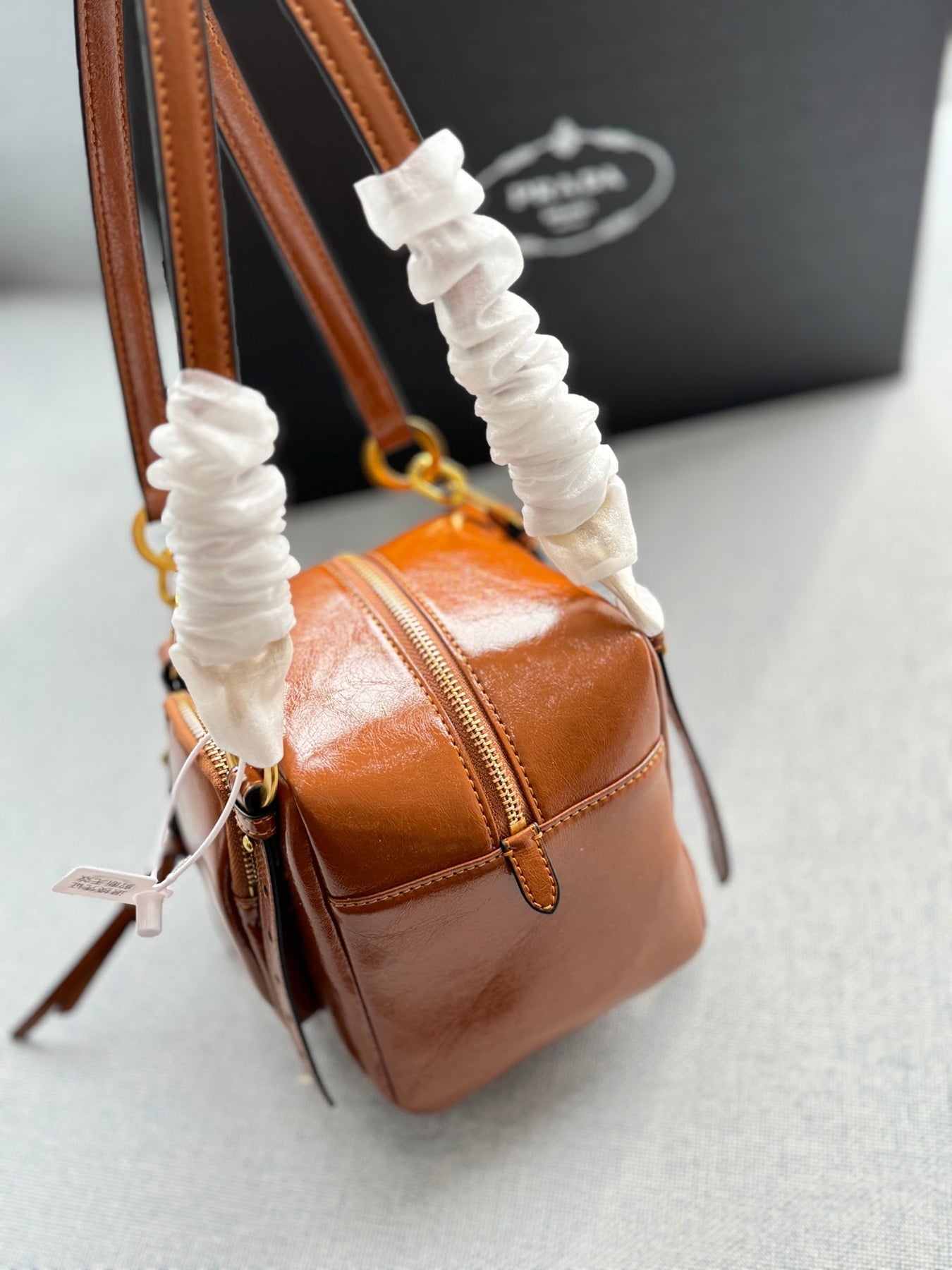 DANGLE TOP HANDLE MINI BAG 15 IN BROWN PATENT CALFSKIN