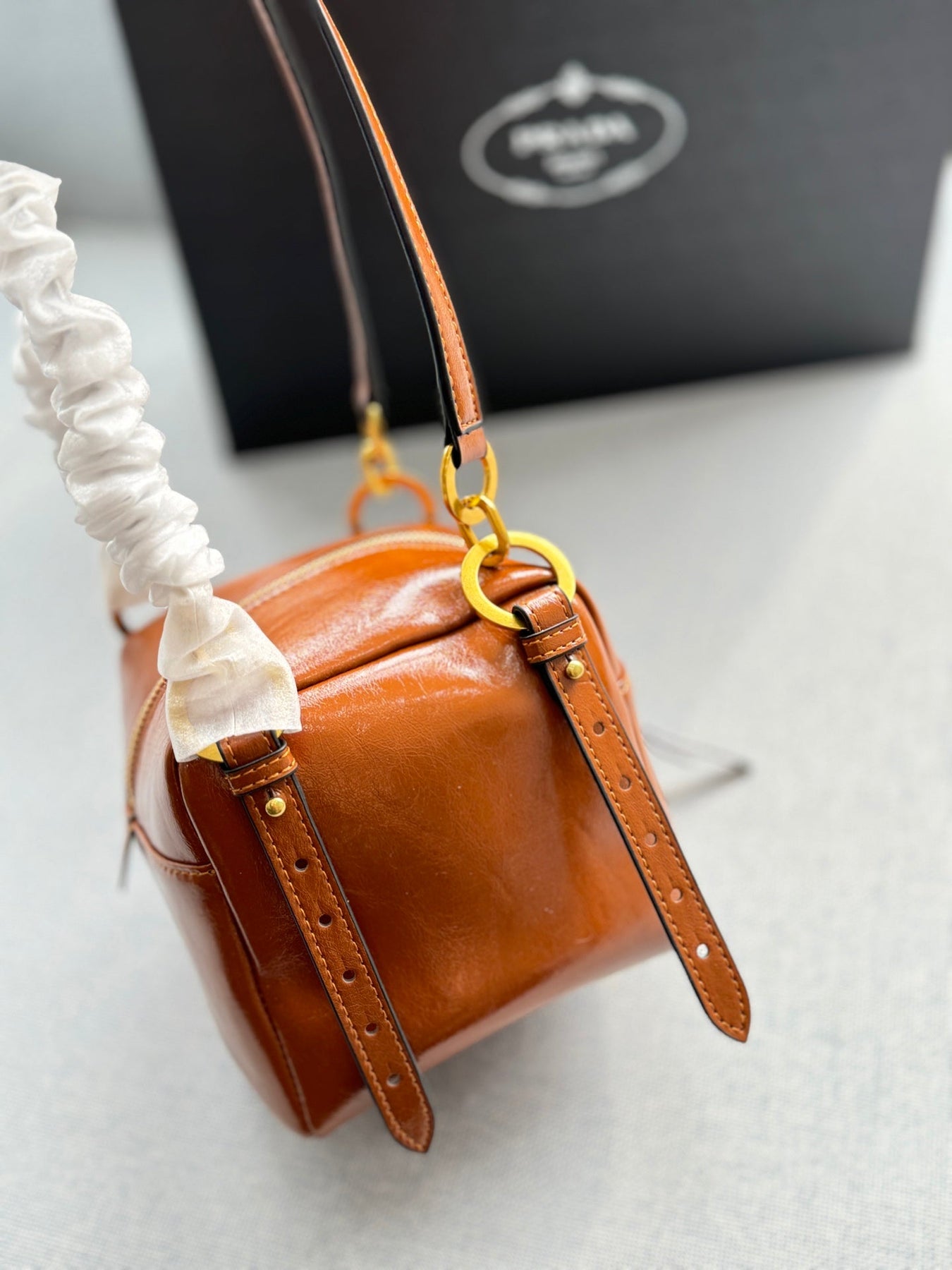 DANGLE TOP HANDLE MINI BAG 15 IN BROWN PATENT CALFSKIN