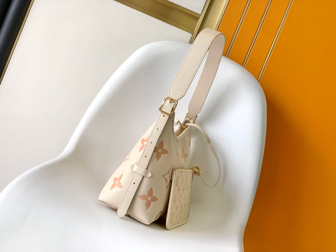 CARRYALL PM 29 BAG IN BEIGE MIX PINK MONOGRAM EMPREINTE LEATHER