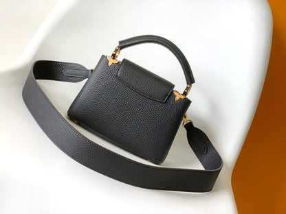 CAPUCINES MM BAG 21 IN BLACK TAURILLON COWHIDE GOLD HARDWARE