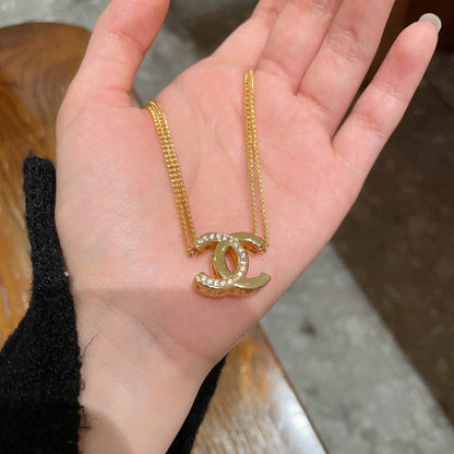 DOUBLE C HEART NECKLACE IN GOLD METAL