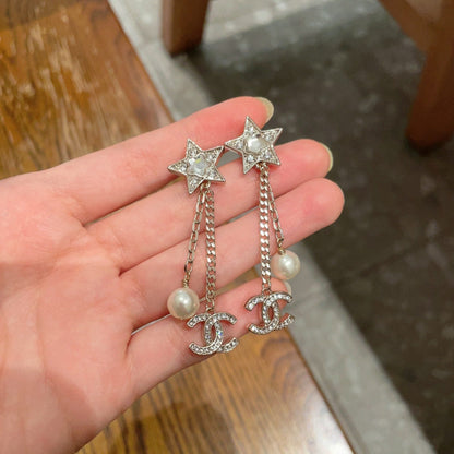 DOUBLE C STUD EARRINGS IN GOLD METAL STAR STONE DOUBLE CHAINS ONE WITH LOGO AND ONE WITH PEARL