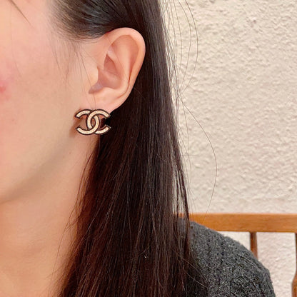 DOUBLE C STUD EARRINGS IN SILVER METAL WITH BLACK OUTLINE AND CRYSTALS INSIDE