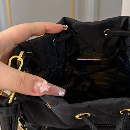 DRAWSTRING BUCKET BAG 23 IN BLACK QUILTED RE-NYLON